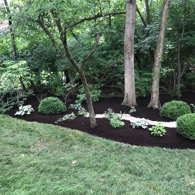 Dry creek bed, edging, and mulching.